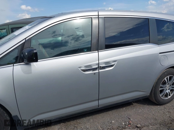 2012 Honda Odyssey EX-L with VIN 5FNRL5H68CB131431, listed as a IAAI auction lot 42012749 with 245,649 mi miles and . Bid and sale history available at carsss.com. Image 14.