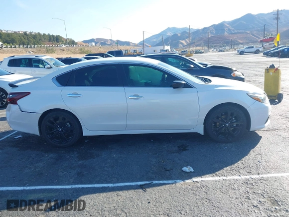 2018 Nissan Altima S with VIN 1N4AL3AP5JC294610, listed as a IAAI auction lot 41436696 with 124,835 mi miles and . Bid and sale history available at DreamBid. Image 13.
