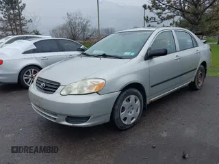 2003 Toyota Corolla CE with VIN 2T1BR32E13C051798, listed as a IAAI auction lot 42009353 with 153,941 mi miles and . Bid and sale history available at DreamBid. Image 2.