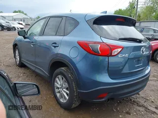 2016 Mazda CX-5 Touring z VIN JM3KE2CY3G0728968, wystawiony jako IAAI lot #42189174 z przebiegiem 145 977 mil mil oraz . Historia ofert i sprzedaży dostępna na DreamBid. Obrazek 3.