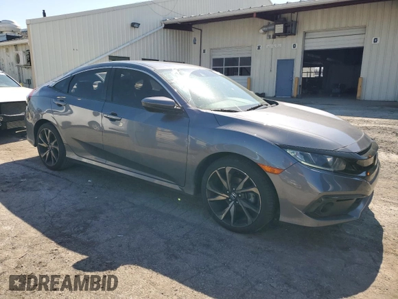 2019 Honda Civic Sport with VIN 2HGFC2F80KH565567, listed as a Copart auction lot 52384625 with 89,947 mi miles and Salvage title. Bid and sale history available at DreamBid. Image 4.