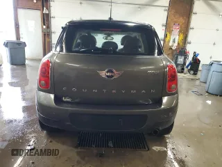 2014 MINI Countryman with VIN WMWZB3C59EWR42124, listed as a Copart auction lot 57830395 with 125,000 mi miles and Salvage title. Bid and sale history available at DreamBid. Image 6.