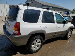 2002 Mazda Tribute LX with VIN 4F2YU09132KM10219, listed as a Copart auction lot 70619724 with 202,687 mi miles and Salvage Title. Bid and sale history available at carsss.com. Image 3.
