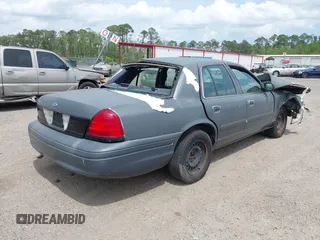 2001 Ford Crown Victoria Police Interceptor z VIN 2FAFP71W71X143506, wystawiony jako IAAI lot #41962780 z przebiegiem 254 040 mil mil oraz . Historia ofert i sprzedaży dostępna na DreamBid. Obrazek 4.