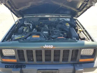 1998 Jeep Cherokee Sport with VIN 1J4FJ68S5WL108020, listed as a Copart auction lot 60150655 with 290,595 mi miles and Salvage title. Bid and sale history available at DreamBid. Image 12.