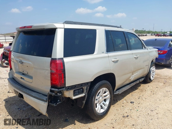 2015 Chevrolet Tahoe LS with VIN 1GNSCAKC9FR294832, listed as a IAAI auction lot 39274877 with 126,932 mi miles and . Bid and sale history available at DreamBid. Image 4.