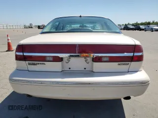 1995 Lincoln Continental z VIN 1LNLM97V3SY641554, wystawiony jako Copart lot #55001165 z przebiegiem 173 490 mil mil oraz Szkody całkowita. Historia ofert i sprzedaży dostępna na DreamBid. Obrazek 6.