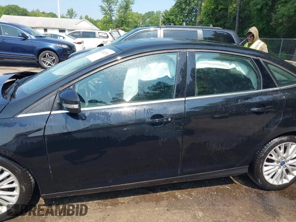 2018 Ford Focus Titanium with VIN 1FADP3J22JL220986, listed as a IAAI auction lot 42410253 with 40,791 mi miles and . Bid and sale history available at DreamBid. Image 14.
