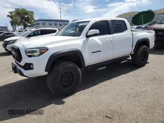 2023 Toyota Tacoma SR with VIN 3TMCZ5AN6PM573079, listed as a Copart auction lot 61684055 with 16,821 mi miles and Salvage title. Bid and sale history available at DreamBid. Image 1.