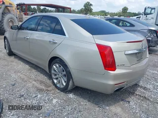 2014 Cadillac CTS Luxury RWD z VIN 1G6AR5SX4E0141195, wystawiony jako IAAI lot #42144565 z przebiegiem 80 267 mil mil oraz . Historia ofert i sprzedaży dostępna na DreamBid. Obrazek 3.