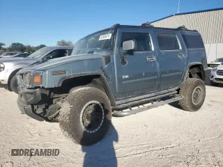 2005 Hummer H2 SUV with VIN 5GRGN23U25H115698, listed as a Copart auction lot 82569874 with 143,367 mi miles and Salvage Title. Bid and sale history available at carsss.com. Image 1.