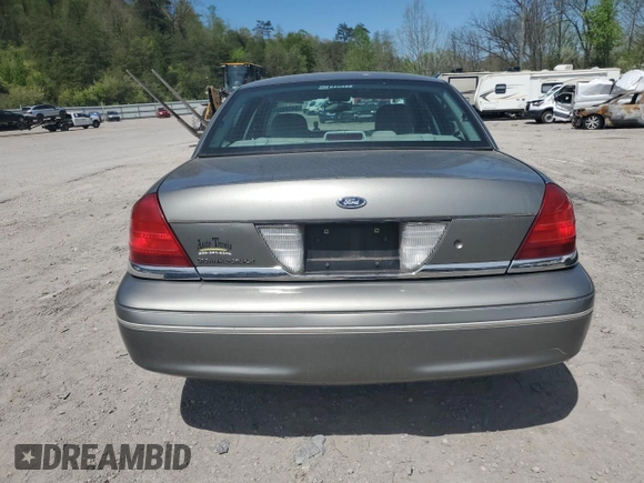 2004 Ford Crown Victoria LX z VIN 2FAFP74W14X130606, wystawiony jako Copart lot #54120085 z przebiegiem 221 700 mil mil oraz Szkody całkowita. Historia ofert i sprzedaży dostępna na DreamBid. Obrazek 6.
