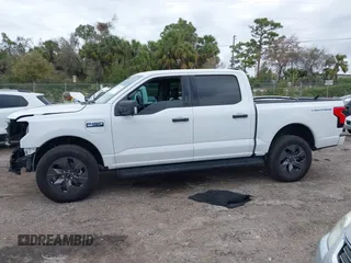 2024 Ford F-150 Lightning XLT with VIN 1FTVW3LKXRWG01185, listed as a IAAI auction lot 41679606 with 4,961 mi miles and . Bid and sale history available at DreamBid. Image 15.