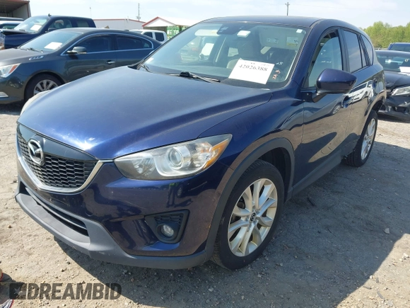 2014 Mazda CX-5 Grand Touring with VIN JM3KE4DYXE0342720, listed as a IAAI auction lot 42026388 with 114,072 mi miles and . Bid and sale history available at carsss.com. Image 18.