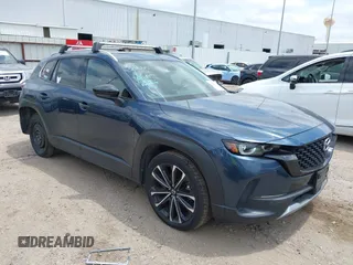 2023 Mazda CX-50 Premium Plus with VIN 7MMVABEY2PN129125, listed as a IAAI auction lot 42291664 with 22,636 mi miles and . Bid and sale history available at DreamBid. Image 1.