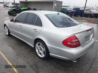 2003 Mercedes-Benz E-Class 5.5L AMG with VIN WDBUF76J93A351317, listed as a IAAI auction lot 41573446 with 144,119 mi miles. Bid and sale history available at carsss.com. Image 3.