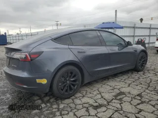 2022 Tesla Model 3 Long Range with VIN 5YJ3E1EB9NF117339, listed as a Copart auction lot 55659415 with 87,479 mi miles and Salvage Title. Bid and sale history available at DreamBid. Image 3.