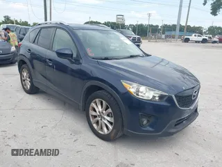 2014 Mazda CX-5 Grand Touring with VIN JM3KE2DY8E0425258, listed as a IAAI auction lot 42179452 with 132,137 mi miles. Bid and sale history available at carsss.com. Image 1.