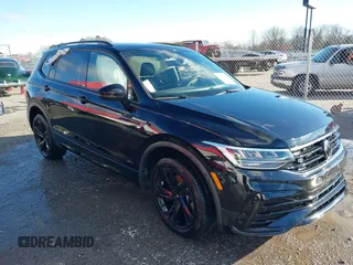 2023 Volkswagen Tiguan SE R-Line Black with VIN 3VVCB7AX5PM100499, listed as a IAAI auction lot 41261505 with 26,677 mi miles and . Bid and sale history available at DreamBid. Image 1.