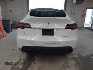 2023 Tesla Model Y Long Range with VIN 7SAYGDEE7PA100523, listed as a IAAI auction lot 40399455 with 18,885 mi miles and . Bid and sale history available at DreamBid. Image 16.