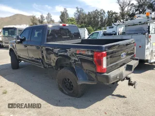 2019 Ford F-350 XL with VIN 1FT8W3BT0KED37509, listed as a Copart auction lot 60283655 with 122,571 mi miles and Salvage title. Bid and sale history available at DreamBid. Image 2.