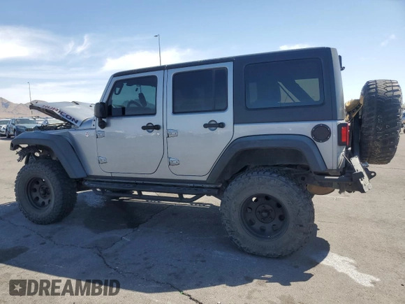 2014 Jeep Wrangler Unlimited Rubicon X with VIN 1C4BJWFG2EL308077, listed as a Copart auction lot 54439265 with 160,746 mi miles and Salvage title. Bid and sale history available at DreamBid. Image 2.