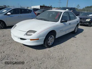 1999 Pontiac Sunfire SE z VIN 1G2JB5247X7575780, wystawiony jako IAAI lot #42143427 z przebiegiem Nie podano mil oraz . Historia ofert i sprzedaży dostępna na DreamBid. Obrazek 2.