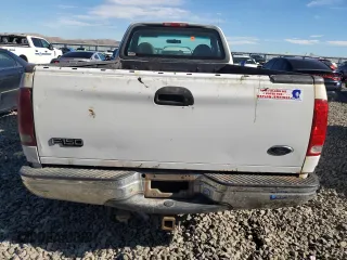1999 Ford F-150 z VIN 1FTRF18W1XKA87801, wystawiony jako Copart lot #79094454 z przebiegiem Nie podano mil oraz Szkoda całkowita • Salvage title. Historia ofert i sprzedaży dostępna na DreamBid. Obrazek 6.