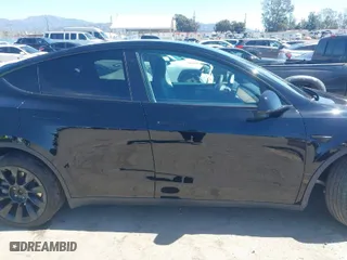 2023 Tesla Model Y Long Range with VIN 7SAYGDEE9PF591096, listed as a IAAI auction lot 41762917 with 22,582 mi miles. Bid and sale history available at carsss.com. Image 13.