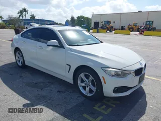 2015 BMW 4 Series 428i xDrive with VIN WBA4C9C56FG135520, listed as a IAAI auction lot 41574336 with 70,870 mi miles and . Bid and sale history available at carsss.com. Image 1.