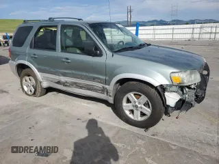 2005 Ford Escape Hybrid z VIN 1FMCU95HX5KE24619, wystawiony jako Copart lot #60624765 z przebiegiem 209 937 mil mil oraz Nie do naprawy • Non repairable. Historia ofert i sprzedaży dostępna na DreamBid. Obrazek 4.