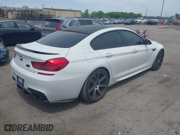 2015 BMW M6 z VIN WBS6C9C50FD467538, wystawiony jako IAAI lot #42366043 z przebiegiem 66 379 mil mil oraz . Historia ofert i sprzedaży dostępna na DreamBid. Obrazek 4.