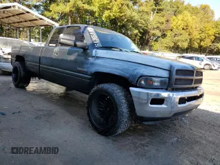 1999 Dodge Ram 2500 with VIN 1B7KC2368XJ548487, listed as a Copart auction lot 77256244 with 301,818 mi miles and Salvage Title. Bid and sale history available at carsss.com. Image 4.