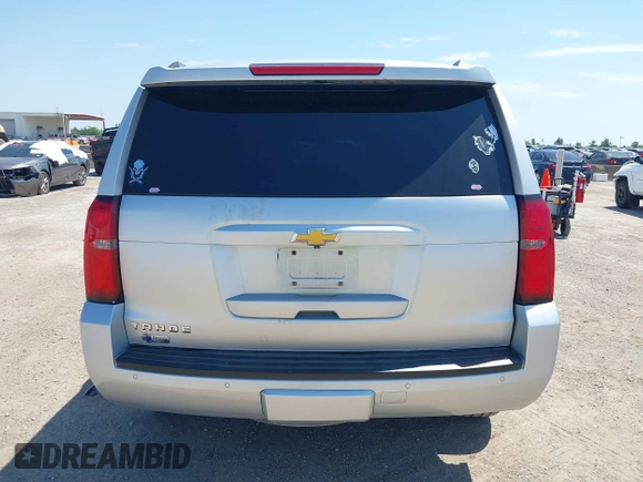 2015 Chevrolet Tahoe LT with VIN 1GNSCBKC6FR303850, listed as a IAAI auction lot 42254115 with 147,856 mi miles and . Bid and sale history available at DreamBid. Image 16.