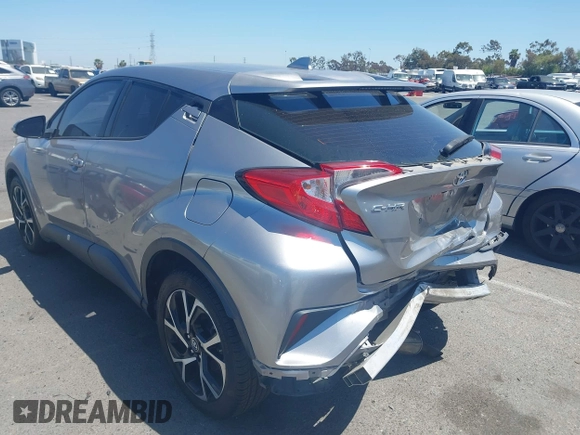 2018 Toyota C-HR XLE z VIN NMTKHMBX2JR057798, wystawiony jako IAAI lot #42327724 z przebiegiem 115 715 mil mil oraz . Historia ofert i sprzedaży dostępna na DreamBid. Obrazek 3.