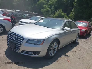 2011 Audi A8 with VIN WAURVAFD4BN019033, listed as a IAAI auction lot 42532173 with 97,486 mi miles and . Bid and sale history available at DreamBid. Image 2.