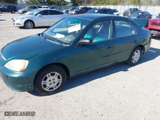 2001 Honda Civic LX with VIN 2HGES16551H567764, listed as a IAAI auction lot 41908288 with 137,740 mi miles. Bid and sale history available at carsss.com. Image 2.