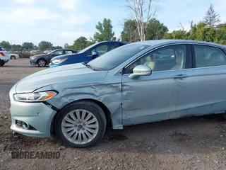 2014 Ford Fusion SE Hybrid with VIN 3FA6P0LU2ER168949, listed as a IAAI auction lot 40366468 with 188,802 mi miles. Bid and sale history available at carsss.com. Image 6.