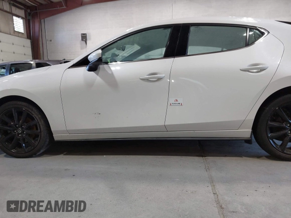 2021 Mazda 3 Premium with VIN JM1BPBML6M1348258, listed as a IAAI auction lot 42752477 with 35,285 mi miles and . Bid and sale history available at DreamBid. Image 6.