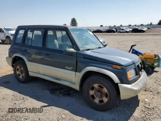 1998 Suzuki Sidekick z VIN JS3TD21V9W4103914, wystawiony jako Copart lot #62112514 z przebiegiem 394 872 mil mil oraz Szkody całkowita. Historia ofert i sprzedaży dostępna na DreamBid. Obrazek 4.