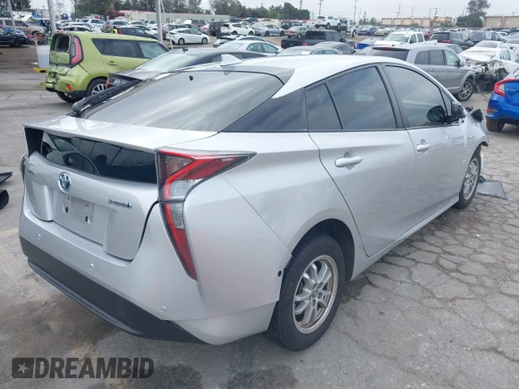 2018 Toyota Prius Two with VIN JTDKARFU0J3056217, listed as a IAAI auction lot 42185122 with 52,344 mi miles and . Bid and sale history available at DreamBid. Image 4.