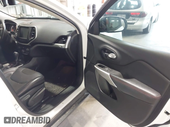 2017 Jeep Cherokee Trailhawk with VIN 1C4PJMBS5HW614956, listed as a IAAI auction lot 42079991 with 143,378 mi miles and . Bid and sale history available at DreamBid. Image 5.