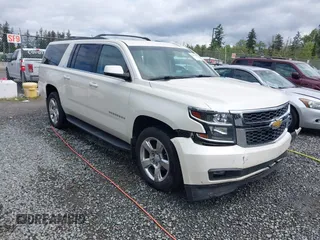 2015 Chevrolet Suburban LT z VIN 1GNSKJKCXFR724385, wystawiony jako IAAI lot #42313388 z przebiegiem 169 444 mil mil oraz . Historia ofert i sprzedaży dostępna na DreamBid. Obrazek 1.