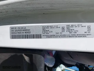 2021 Ram ProMaster Cargo Van with VIN 3C6LRVDG1ME523121, listed as a IAAI auction lot 42076794 with 91,589 mi miles. Bid and sale history available at carsss.com. Image 9.