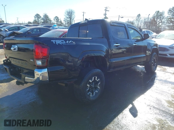 2018 Toyota Tacoma SR with VIN 5TFCZ5ANXJX124991, listed as a IAAI auction lot 41136867 with 57,980 mi miles and . Bid and sale history available at carsss.com. Image 4.