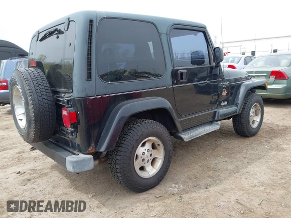2001 Jeep Wrangler Sahara with VIN 1J4FA59S81P321733, listed as a IAAI auction lot 42164863 with 174,509 mi miles. Bid and sale history available at carsss.com. Image 4.