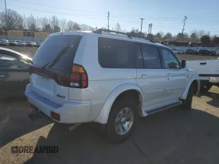 2003 Mitsubishi Montero z VIN JA4MT41RX3J013246, wystawiony jako Copart lot #42210545 z przebiegiem 188 387 mil mil oraz Szkoda całkowita • Salvage title. Historia ofert i sprzedaży dostępna na DreamBid. Obrazek 3.
