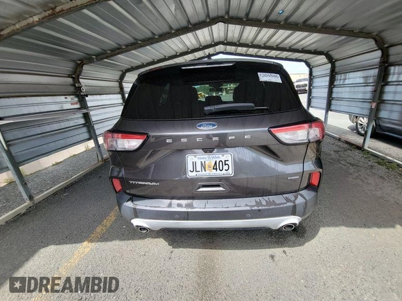 2020 Ford Escape Titanium Hybrid with VIN 1FMCU0DZ2LUB82013, listed as a IAAI auction lot 42727391 with 92,623 mi miles and . Bid and sale history available at DreamBid. Image 4.