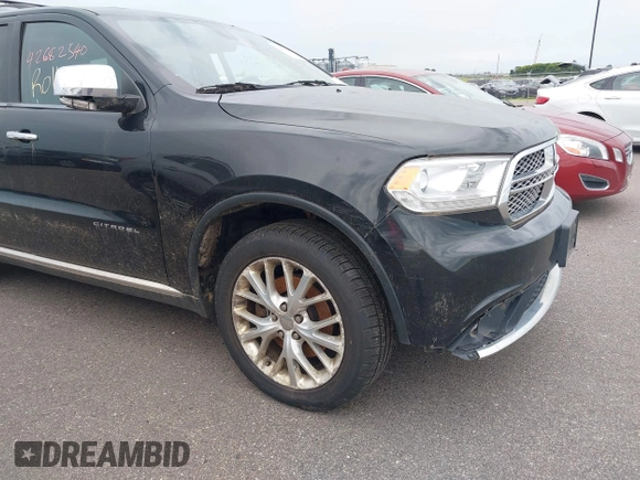 2014 Dodge Durango Citadel with VIN 1C4SDJET5EC314304, listed as a IAAI auction lot 42682540 with 213,651 mi miles and . Bid and sale history available at DreamBid. Image 6.