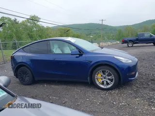 2023 Tesla Model Y Long Range z VIN 7SAYGDEE6PF603981, wystawiony jako IAAI lot #42133348 z przebiegiem 28 566 mil mil oraz . Historia ofert i sprzedaży dostępna na DreamBid. Obrazek 14.